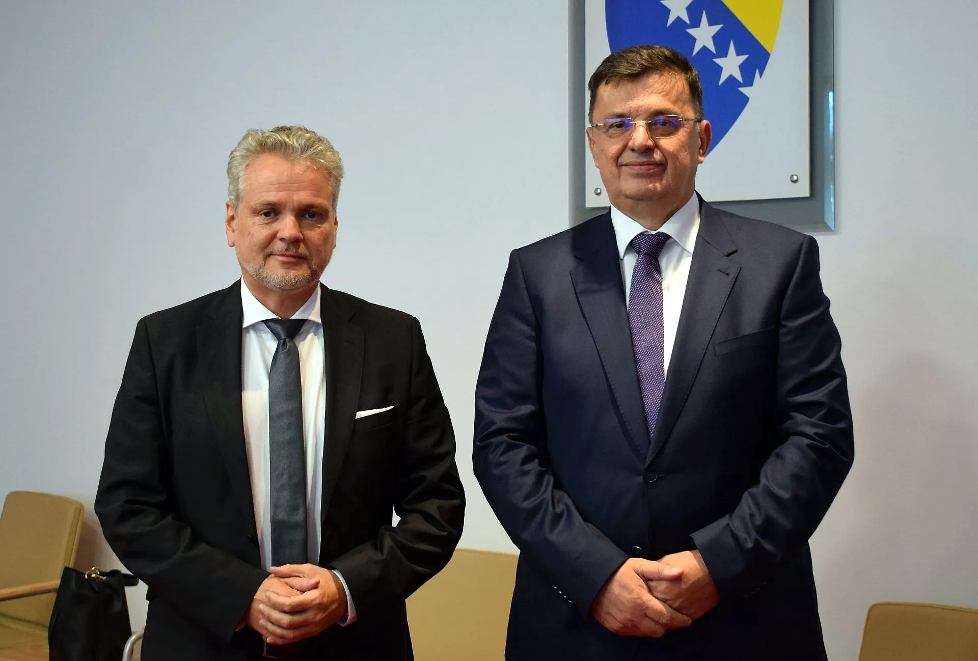 Chairman Tegeletija talks with Ambassador Sattler